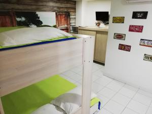 a bedroom with a bunk bed and a refrigerator at APARTA ESTUDIO 7051 in Medellín
