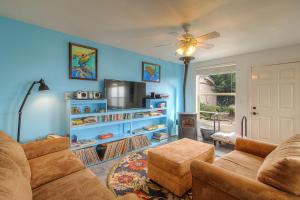 a living room with a couch and a tv at Welcome to My View"" in Bridgehaven