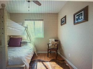 a bedroom with a bunk bed and a staircase at Z Ranch in Templeton