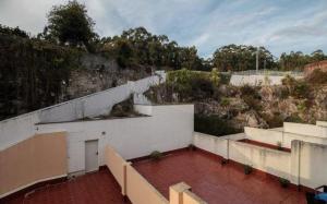 a building with a red brick floor and a wall at Apartamento Covelo in Poio