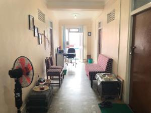 a hallway with chairs and a fan in a room at Gorkha Chhen bed & breakfast in Gorkhā