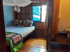 Postel nebo postele na pokoji v ubytování Bong's Guesthouse M'Pai Bay