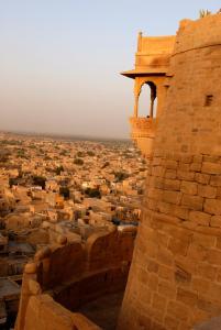 a stone building with a clock on top of it at Killa Bhawan in Jaisalmer