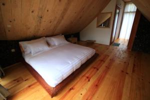 Voodi või voodid majutusasutuse Padi Ecolodge toas