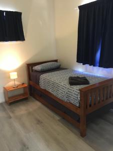 Ένα ή περισσότερα κρεβάτια σε δωμάτιο στο Oceanside Village +24 φωτογραφίες