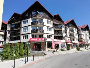 a large apartment building on the side of a street at Iglika 2, V9 in Borovets