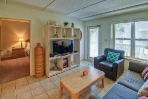 a living room with a couch and a table at Surfside Condos in South Padre Island