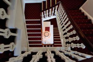 a close up of a staircase with a clock on it at Station Hotel in Thurso