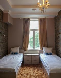 Postel nebo postele na pokoji v ubytování Villa Kadriorg Hostel