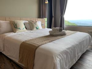 Ένα ή περισσότερα κρεβάτια σε δωμάτιο στο Two Easy Inn