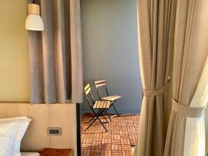 Ένα ή περισσότερα κρεβάτια σε δωμάτιο στο Two Easy Inn