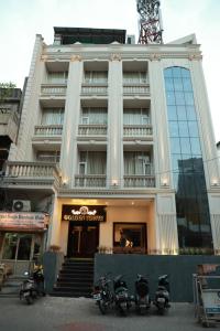 a group of motorcycles parked in front of a building at Hotel Golden Tower Near Heritage Street in Amritsar
