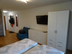 Televízia a/alebo spoločenská miestnosť v ubytovaní Ferienappartement GROCKE