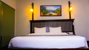 Rúm í herbergi á Hotel Nippon Colombo