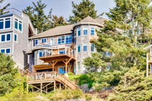 a large house on a hill with trees at Berni's Ocean View Castle - Home Sweet Homestead in Oceanside