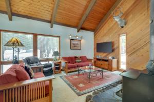 a living room with a couch and a tv at Black Butte Ranch: Hedge Nettle Cabin in Sisters