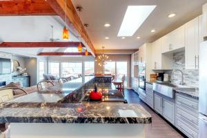 a large kitchen with a large marble counter top at Wapato Point Paradise Point in Manson