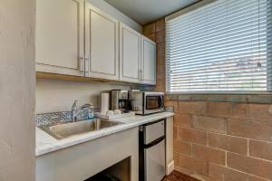 a kitchen with a sink and a microwave at Bella Casa - Loft in Moab