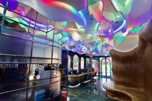 a lobby with a colorful ceiling in a restaurant at Norway Forest Travel hotel 1 Taichung in Taichung