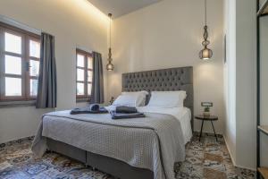 Ліжко або ліжка в номері Casa Poli Suites