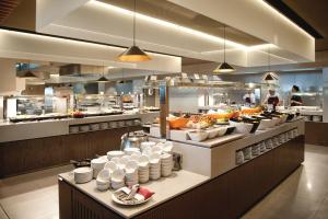 a restaurant kitchen with a buffet of food at Sotavento Beach Club in Costa Calma