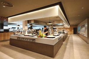 a chef preparing food in a restaurant kitchen at Sotavento Beach Club in Costa Calma