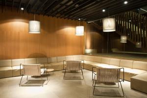 a waiting room with chairs and a couch at Sotavento Beach Club in Costa Calma