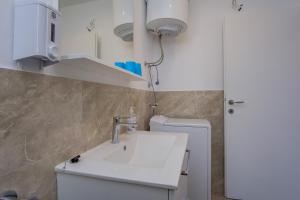 Kúpeľňa v ubytovaní Apartmani Beatrice + 23 fotografií