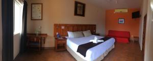 เตียงในห้องที่ Hotel Angra