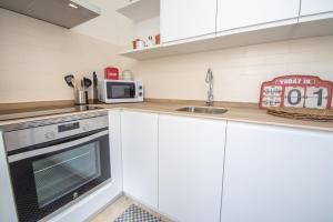 Kuchnia lub aneks kuchenny w obiekcie Apartamentos Las Musas de Cadiz