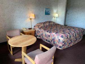 Postel nebo postele na pokoji v ubytování Olde Amish Inn