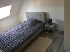Ένα ή περισσότερα κρεβάτια σε δωμάτιο στο duplex agréable et calme