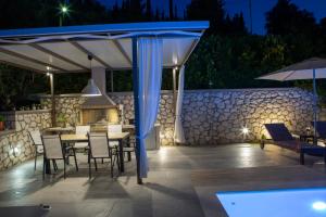 A patio or other outdoor area at Drimonari Villas