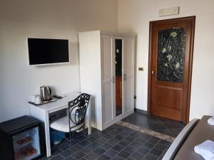 Televízia a/alebo spoločenská miestnosť v ubytovaní B&B Sale e Sole sul Mare