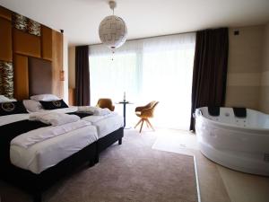 Postel nebo postele na pokoji v ubytování Baobab Suites
