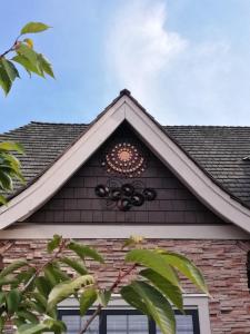 a roof of a house with a clock on it at Sunny Island by White Rock in White Rock