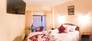 Voodi või voodid majutusasutuse Hawka Inka Hostal - Cusco toas