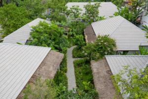 an overhead view of a garden between roofs at La Rivière d' Angkor Resort in Siem Reap