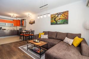 a living room with a couch and a table at Stunning location and views!Foothills of Old town! in Plovdiv