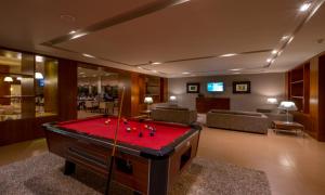 a living room with a pool table in it at Hotel Spa Attica21 Vilalba in Villalba