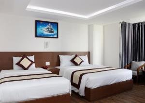 Postel nebo postele na pokoji v ubytování DORADO HOTEL
