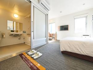 Super Hotel Mihara Ekimae客房内的一张或多张床位