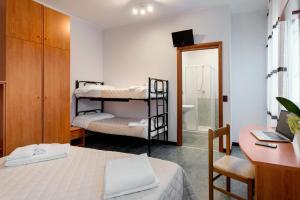 Postel nebo postele na pokoji v ubytování Hotel Pierre