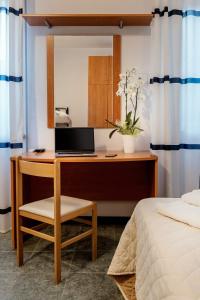 Postel nebo postele na pokoji v ubytování Hotel Pierre