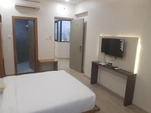TV a/nebo společenská místnost v ubytování Hotel Grace Galaxy + 29 fotografií
