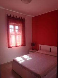 Ένα ή περισσότερα κρεβάτια σε δωμάτιο στο Villa Magie del Mare