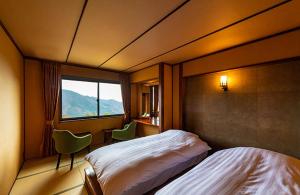 Postel nebo postele na pokoji v ubytování Hakone Kyuan + 37 fotografií