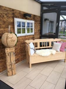 a porch with two beds and a pumpkin on it at Pension Seiboldsmühle in Heideck