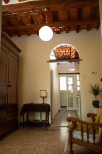 a living room with a table and a window at La Casa di Enea in Pistoia