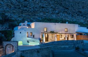 a house on a hill at night at Canava Villas #2 in Santorini Private Pool in Emporio
